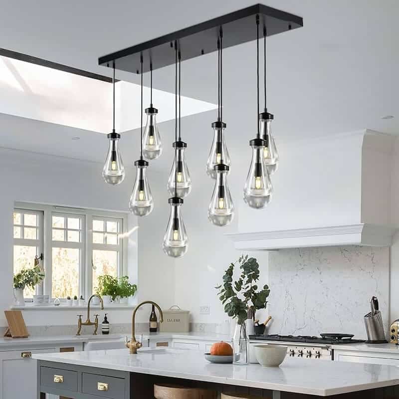 High end pendant lighting over a modern basement bar area