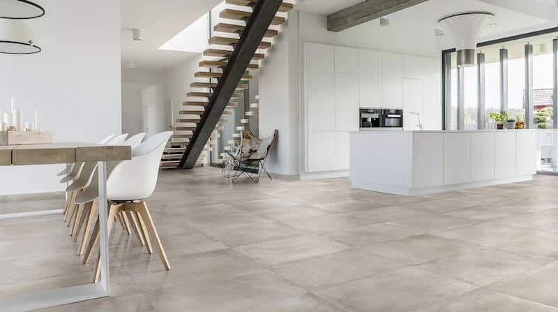 Spacious basement remodel with high-end large format tile floors