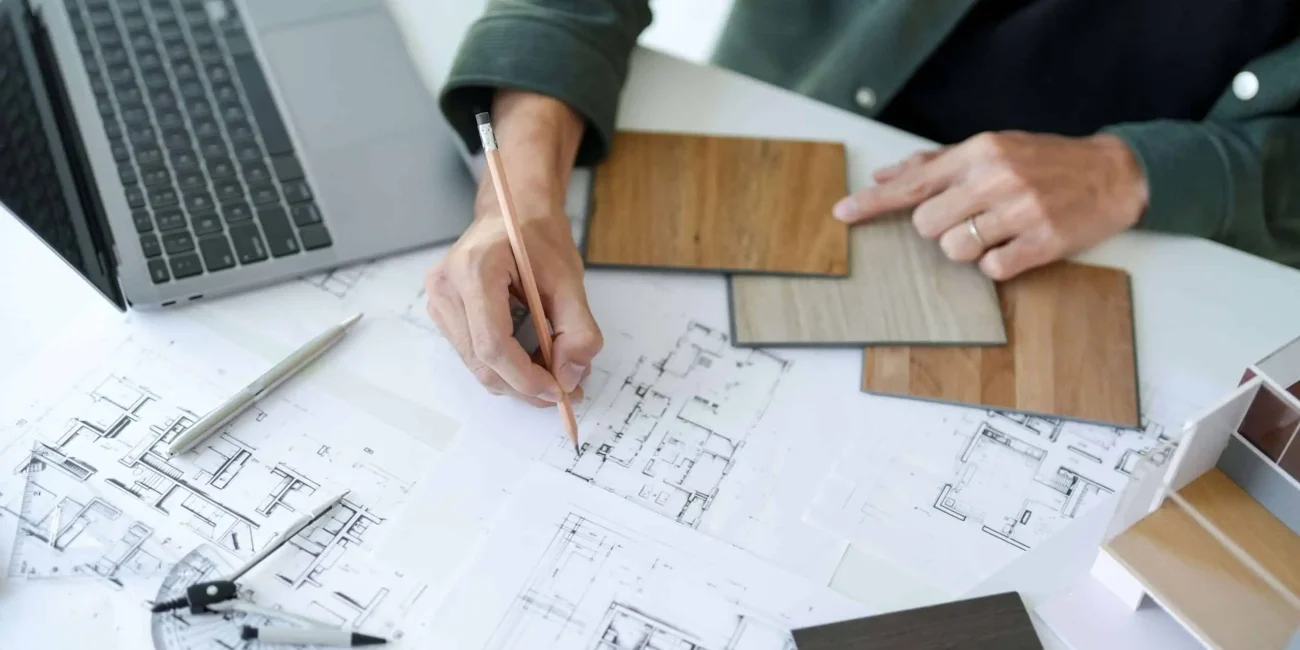 Designer at River North Basement Remodel Company going over zoning rules on upcoming remodel.